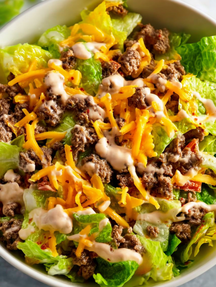 A salad with cheese and meat.