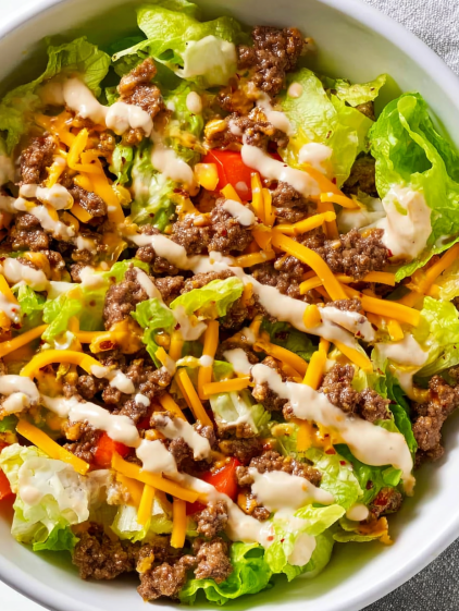 A salad with cheese and tomatoes.