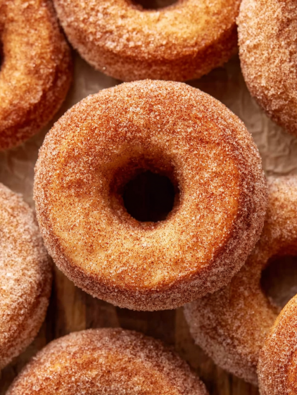 A close up of a sugar donut.