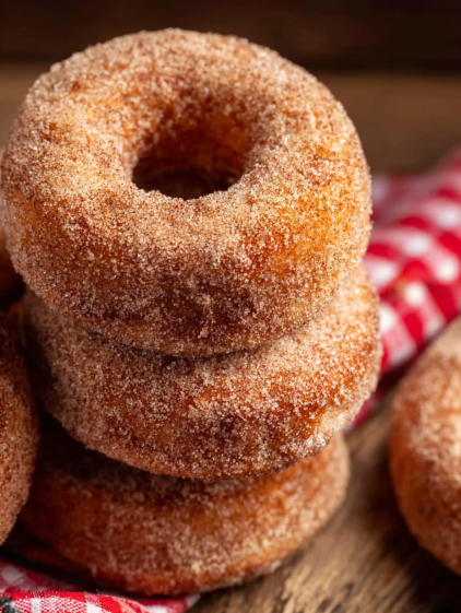 A stack of sugar coated donuts.