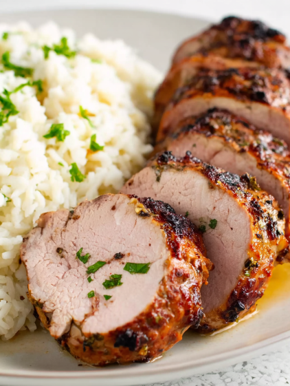 A plate of food with rice and meat.