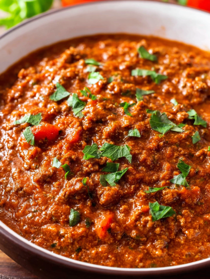 A bowl of crock pot taco meat.