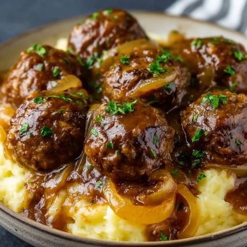 A bowl of slow cooker French onion meatballs.