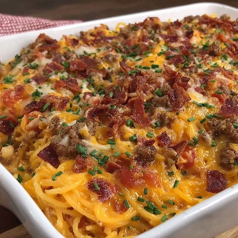 A white bowl filled with a creamy cheesy twist.