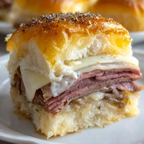 A roast beef sandwich on a Hawaiian roll.